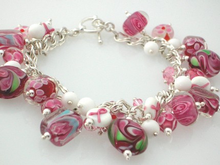 http://artjewelrycollective.files.wordpress.com/2007/11/aliana-designs-pink-lampwork-glass-charm-bracelet.jpg